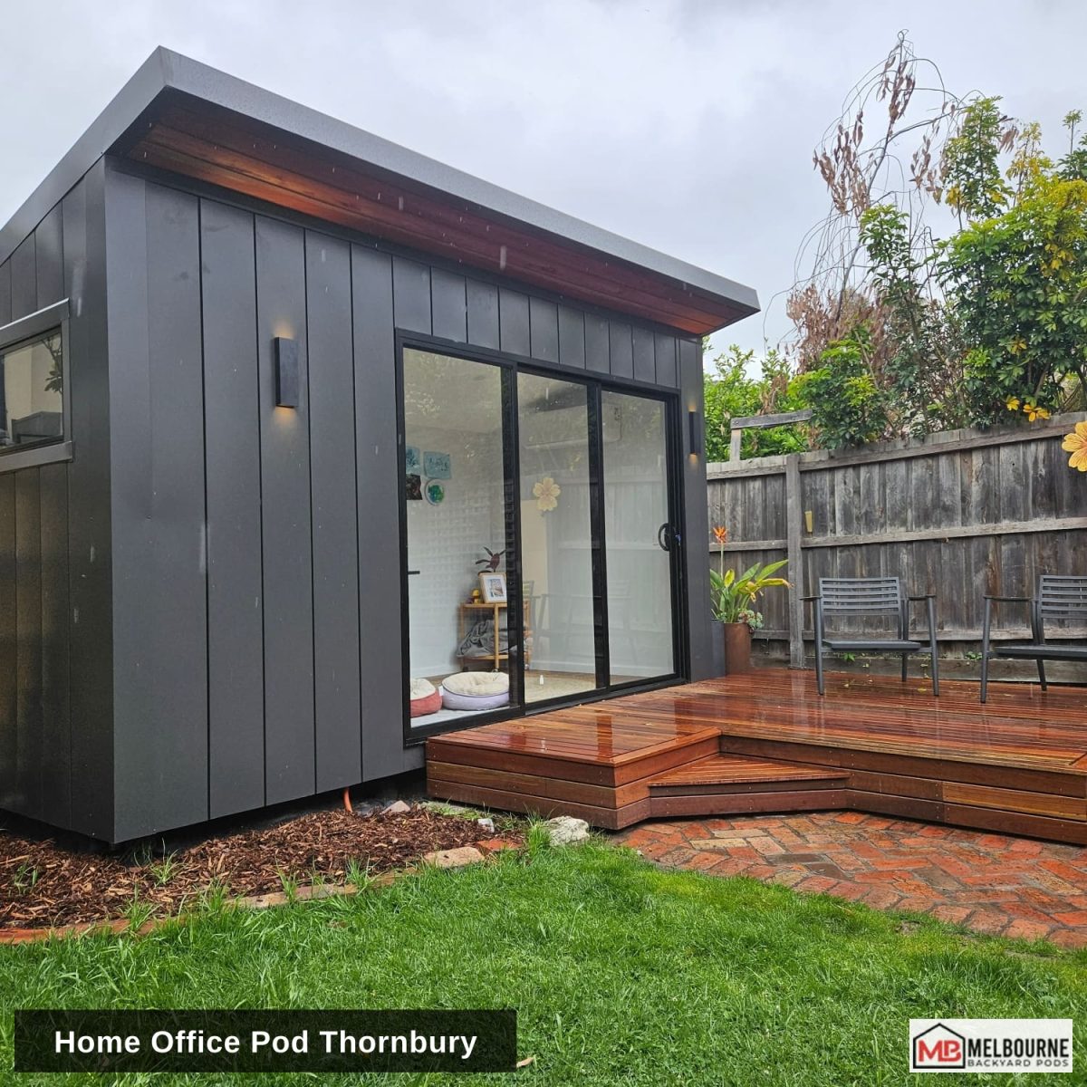 A completed home office pod in Thornbury with a deck and landscaped garden